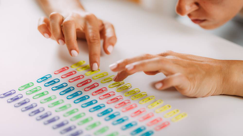 Kid with OCD Arranging Paperclips in a Row