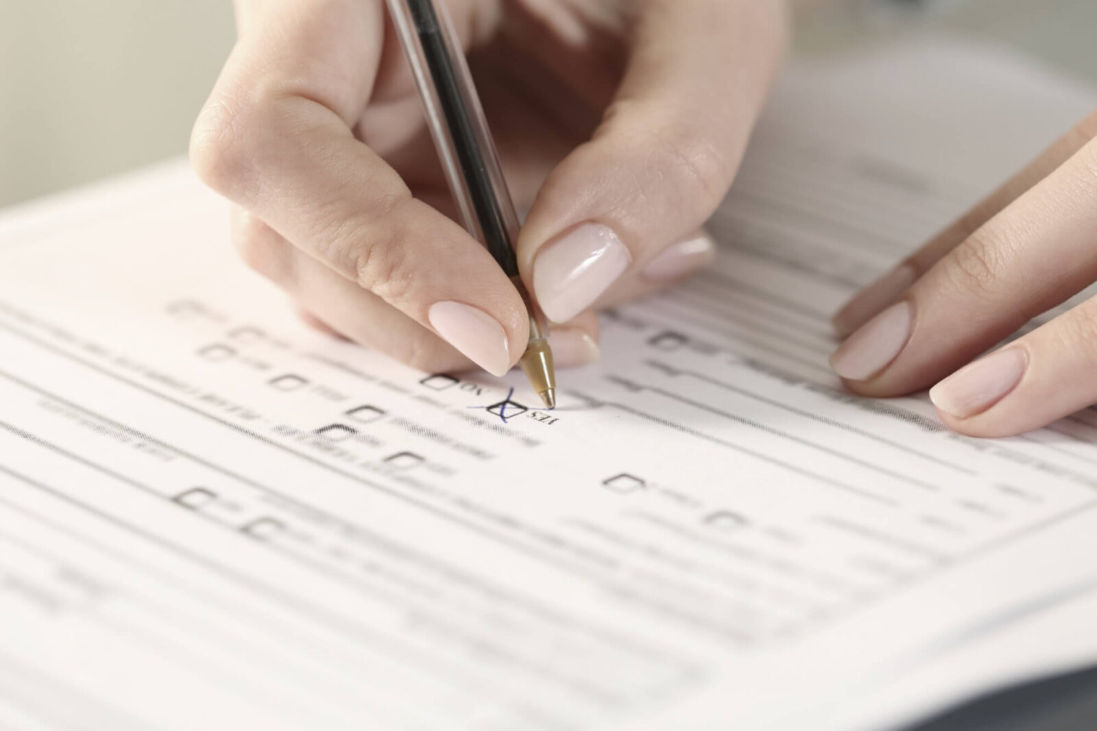 woman hands filling form crossing yes checkbox