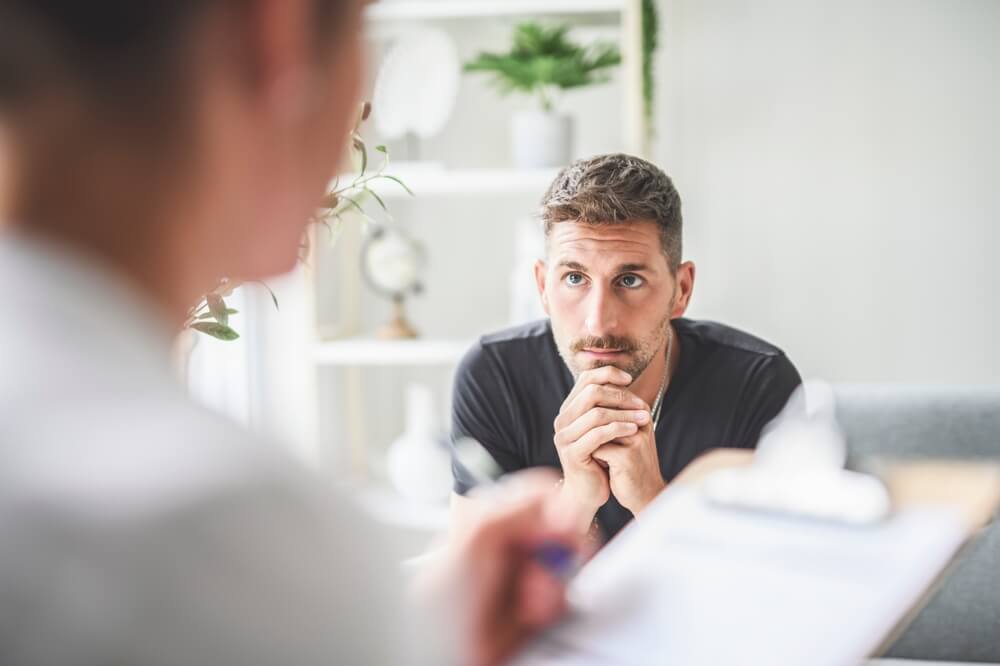 Man with psychologist during therapy session