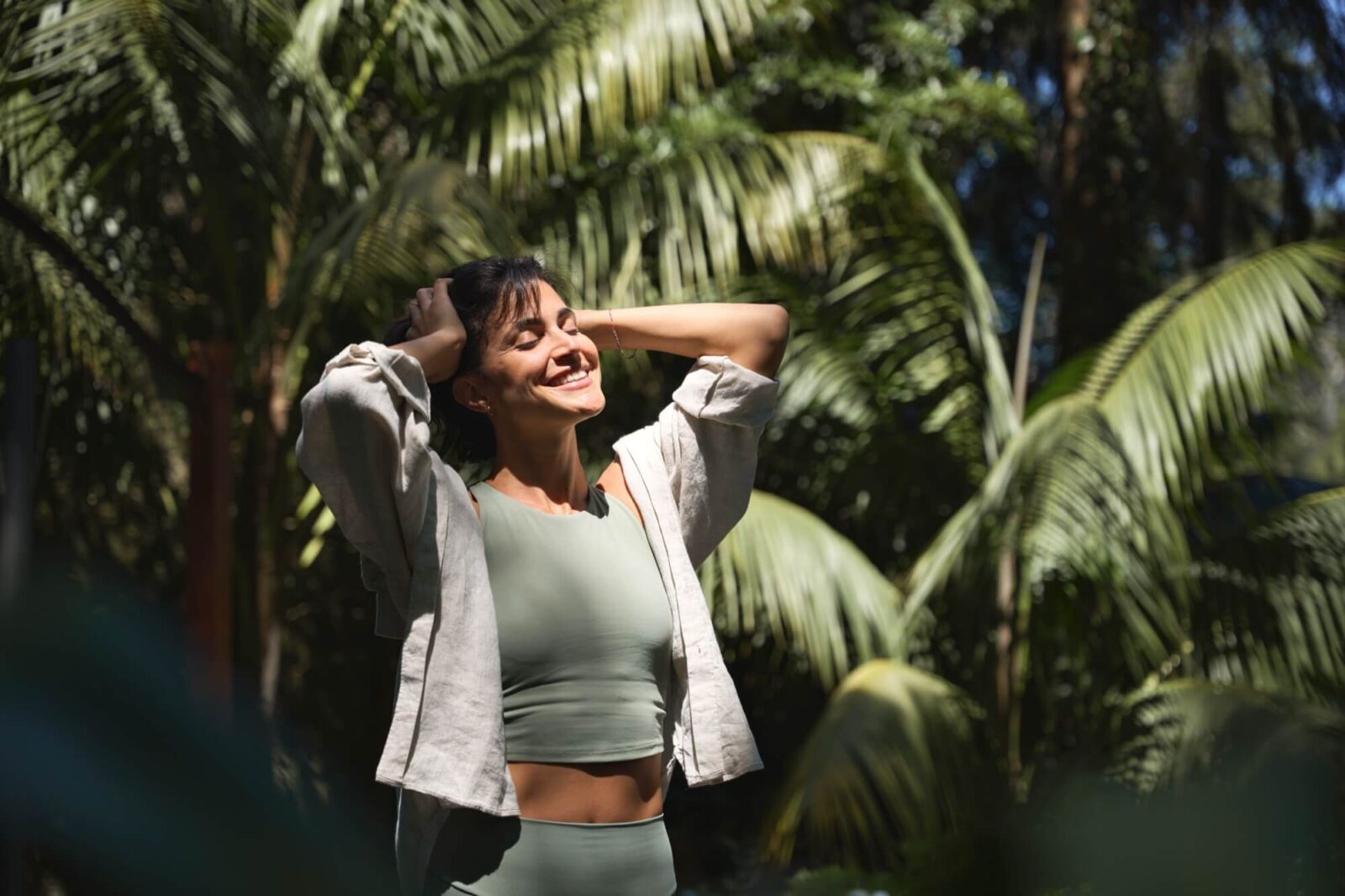 Happy relaxed young woman enjoying summer sunny day