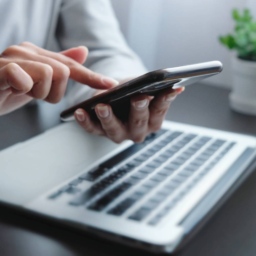 hand of woman using smartphone