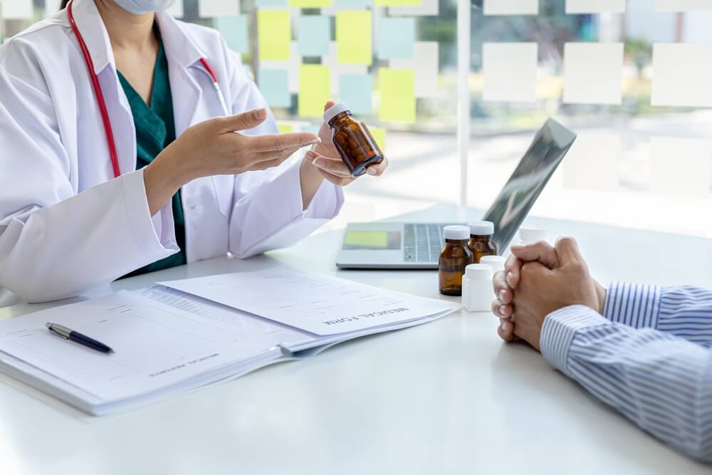 Pharmacist recommending medicines to patient
