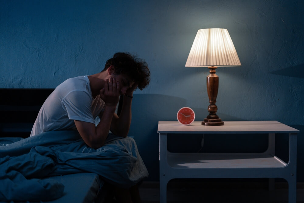 Man struggling to sleep