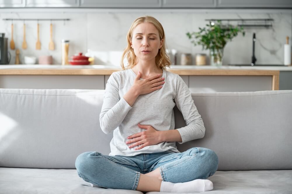 Anxious woman meditating