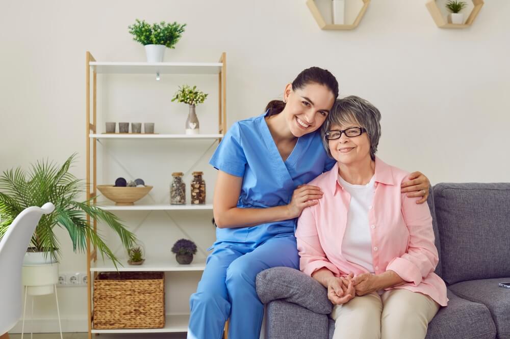 smiling nurse kindly embraces her patient