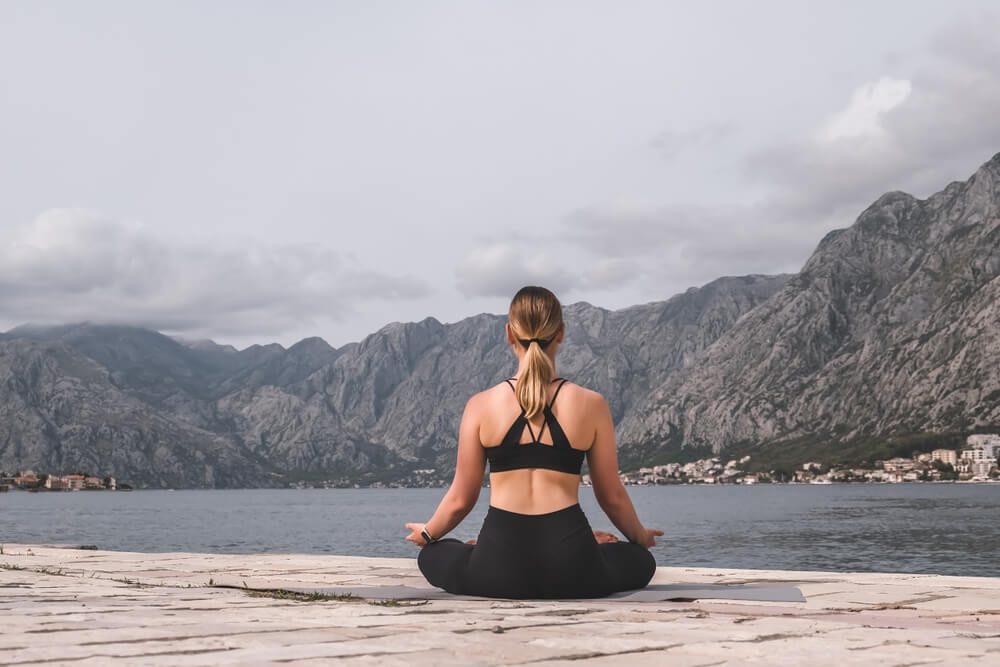 Woman meditating outside