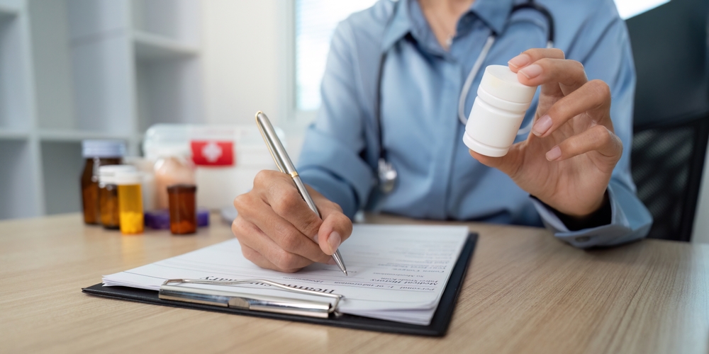 Medical,Documentation,And,Medication,Management.,Doctor,Writing,Prescription,While,Holding