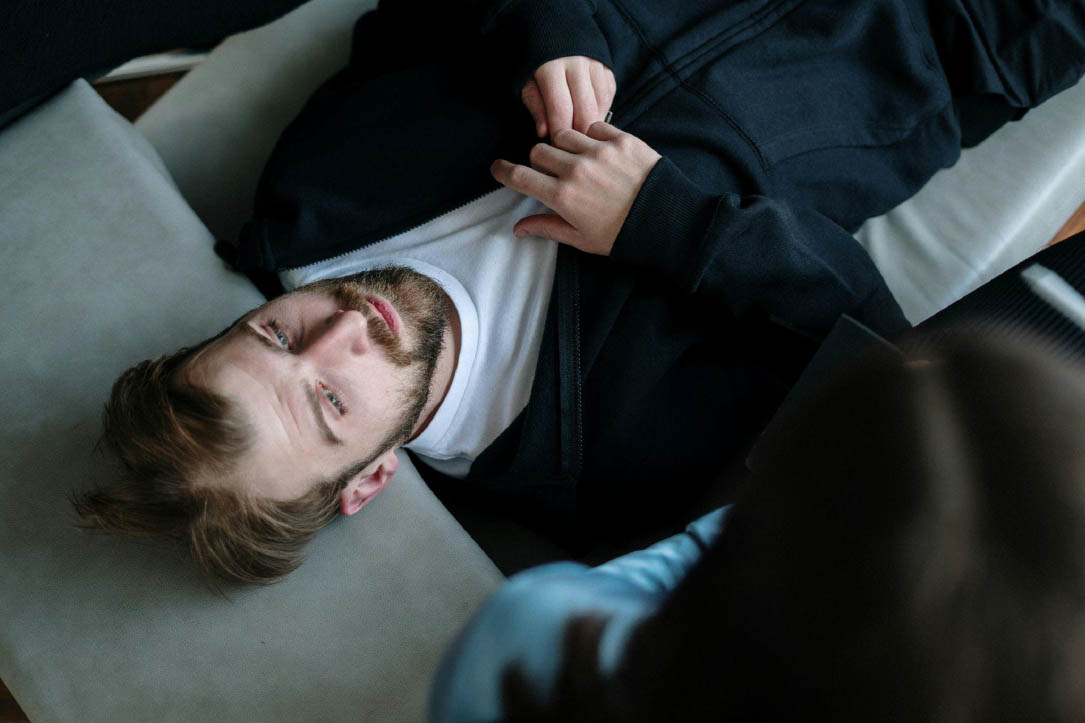 Man receiving depression treatment during a therapy session in Utah.
